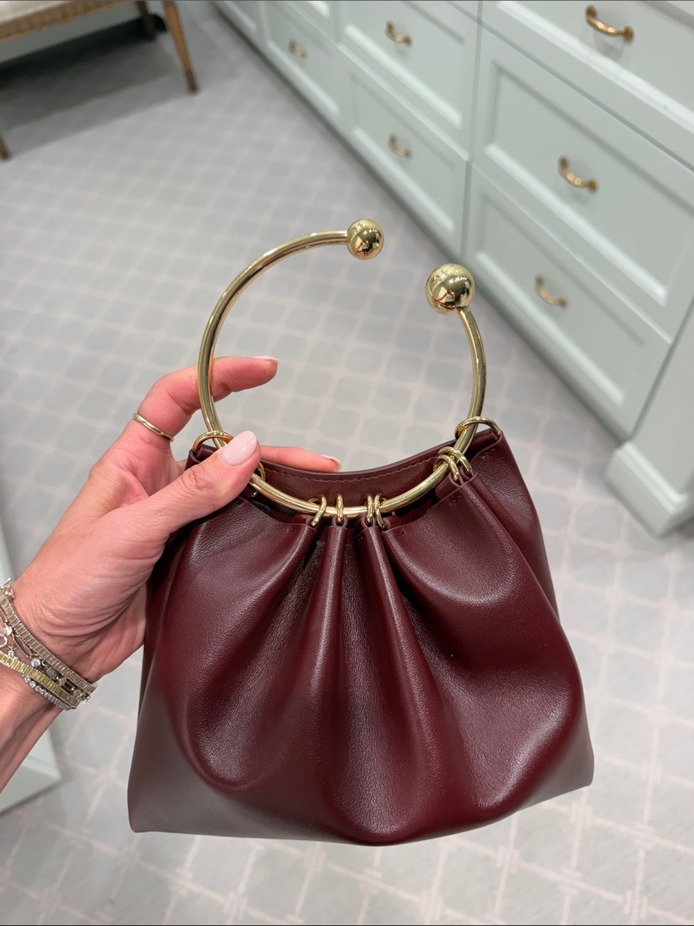 Mini Leather Wristlet Bag with Gold Hoop Handle in Burgundy